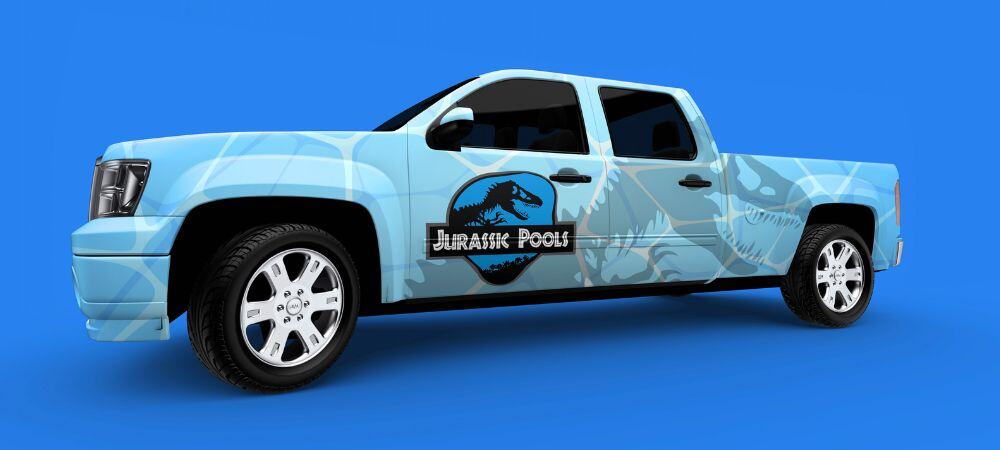 Ford truck wrapped in small business graphics for Jurassic Pools showing brand logo and oversized dinosaur shadow on pool water blue texture